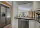 Kitchen featuring stainless steel appliances, granite countertops, and view to dining area at 1345 Witter Gulch Rd, Evergreen, CO 80439