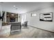 Spacious living area with a stone fireplace, large windows, and comfortable seating for gatherings at 1345 Witter Gulch Rd, Evergreen, CO 80439