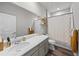 Well-lit bathroom featuring a vanity with sink, shower, and neutral decor at 199 Simmental Loop, Castle Rock, CO 80104