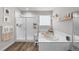 Bathroom featuring a glass-enclosed shower, soaking tub, and a window for natural light at 199 Simmental Loop, Castle Rock, CO 80104