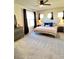 Comfortable bedroom with carpet, ceiling fan, and ample natural light at 199 Simmental Loop, Castle Rock, CO 80104