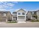 Charming two-story home with a well-manicured lawn and a two-car attached garage at 199 Simmental Loop, Castle Rock, CO 80104