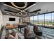 Modern resident game room with foosball table, shuffleboard, and comfortable seating overlooking the landscape at 199 Simmental Loop, Castle Rock, CO 80104