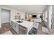 Open-concept kitchen with a large island, stainless steel appliances and open sight lines to the living area at 199 Simmental Loop, Castle Rock, CO 80104