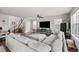 A spacious living room with modern décor with stairs, a TV, and decor at 199 Simmental Loop, Castle Rock, CO 80104