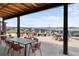Beautiful covered patio offering panoramic mountain views and comfortable seating for outdoor relaxation and entertainment at 199 Simmental Loop, Castle Rock, CO 80104