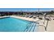 Stunning community pool featuring lounge chairs and umbrellas for relaxation at 199 Simmental Loop, Castle Rock, CO 80104
