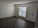 Bright living room with hardwood floors, a large window, and neutral walls at 1167 S Ceylon St, Aurora, CO 80017