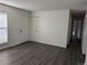 Living room featuring hardwood floors, closet, door and neutral walls at 1167 S Ceylon St, Aurora, CO 80017