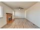 Spacious living room with brick fireplace and hardwood floors at 1167 S Ceylon St, Aurora, CO 80017