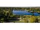 Scenic aerial view of calm lake surrounded by trees with an intricate walking path and lush vegetation at 1215 S Ogden St, Denver, CO 80210