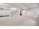 Spacious finished basement with ample lighting and staircase leading to upper level at 1215 S Ogden St, Denver, CO 80210