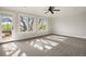 Bright bedroom with large windows, ceiling fan, and balcony access at 1215 S Ogden St, Denver, CO 80210