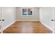 This bedroom features hardwood floors, white trim, and a closet at 1215 S Ogden St, Denver, CO 80210
