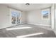 Bright bedroom with a glass door leading to a balcony and a large window at 1215 S Ogden St, Denver, CO 80210