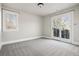Cozy bedroom with access to a balcony and a large window with natural light at 1215 S Ogden St, Denver, CO 80210