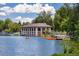 Charming boathouse nestled on the lake with paddle boats and a scenic waterfront view, perfect for recreation at 1215 S Ogden St, Denver, CO 80210