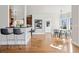 Open concept space with a kitchen bar and breakfast table at 1215 S Ogden St, Denver, CO 80210