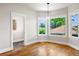 Bright dining room features large windows and hardwood floors at 1215 S Ogden St, Denver, CO 80210