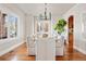 Light and airy dining room features hardwood floors, a modern chandelier, and comfortable seating at 1215 S Ogden St, Denver, CO 80210