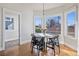 Charming dining nook with bay windows and a modern light fixture at 1215 S Ogden St, Denver, CO 80210