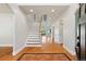 This foyer features a staircase, hardwood floors, and an open floor plan at 1215 S Ogden St, Denver, CO 80210
