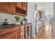 Butler's pantry with wine rack and refrigerator with stainless steel appliances at 1215 S Ogden St, Denver, CO 80210