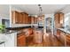 Beautiful kitchen featuring custom cabinets, granite countertops, and a central island with cooktop at 1215 S Ogden St, Denver, CO 80210