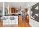 Updated kitchen boasts wood cabinets, granite countertops, stainless steel appliances, and an island cooktop at 1215 S Ogden St, Denver, CO 80210