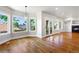 Spacious living room with hardwood floors, fireplace, and lots of natural light at 1215 S Ogden St, Denver, CO 80210