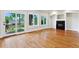 Cozy living room with fireplace, hardwood floors, and backyard views at 1215 S Ogden St, Denver, CO 80210