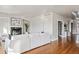 Elegant living room featuring a fireplace, hardwood floors, and neutral decor at 1215 S Ogden St, Denver, CO 80210