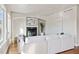 Bright and airy living room features hardwood floors, a fireplace, and neutral decor at 1215 S Ogden St, Denver, CO 80210