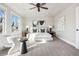 Spacious main bedroom with a ceiling fan, neutral paint, and natural light from the window at 1215 S Ogden St, Denver, CO 80210