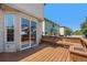 Charming backyard deck with a sliding glass door, offering a seamless transition to outdoor living at 9735 E 112Th Pl, Commerce City, CO 80640