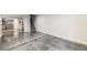 Finished basement with epoxy floors, open layout, and natural light at 9735 E 112Th Pl, Commerce City, CO 80640