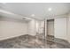 An open finished basement with recessed lighting, closet, and glossy epoxy flooring at 9735 E 112Th Pl, Commerce City, CO 80640