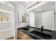 Bright bathroom with a double sink vanity, modern fixtures and a shower with white subway tile at 9735 E 112Th Pl, Commerce City, CO 80640