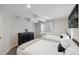 Cozy bedroom with two beds, soft lighting, and a minimalist decor, offering a peaceful retreat at 9735 E 112Th Pl, Commerce City, CO 80640