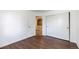 This bedroom has wood flooring, a closet, and extra room access at 9735 E 112Th Pl, Commerce City, CO 80640