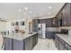 Modern kitchen with granite countertops, stainless steel appliances, a large island, and an open layout at 9735 E 112Th Pl, Commerce City, CO 80640