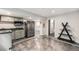 This bright kitchenette includes stainless steel appliances and a modern design at 9735 E 112Th Pl, Commerce City, CO 80640