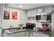 The kitchenette features modern appliances, stylish decor, and ample countertop space at 9735 E 112Th Pl, Commerce City, CO 80640
