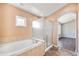 This main bathroom has a soaking tub and a glass-enclosed shower at 9735 E 112Th Pl, Commerce City, CO 80640
