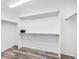 An organized walk-in closet featuring ample shelving and hanging space at 9735 E 112Th Pl, Commerce City, CO 80640