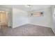 Cozy bedroom with neutral carpet, white walls, closet, and a bright window at 1303 Havana St, Aurora, CO 80010