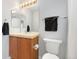 Clean bathroom with a vanity, mirror, and essential fixtures at 767 Roslyn St # 20, Denver, CO 80230