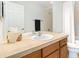 Bright bathroom featuring tile countertop, recessed lighting, and shower with curtain at 767 Roslyn St # 20, Denver, CO 80230