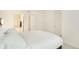 Serene bedroom with a minimalist design, carpet and ensuite bathroom access at 767 Roslyn St # 20, Denver, CO 80230
