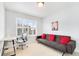 Neutral colored room with a futon, desk, and window with shutter-style blinds at 767 Roslyn St # 20, Denver, CO 80230